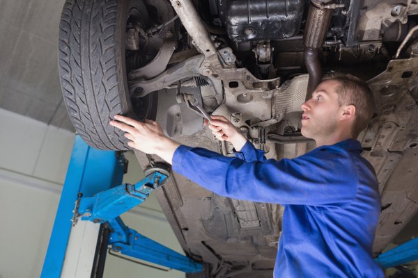 Wavebreakmedia Ltd/Wavebreak Media/Getty Images Male mechanic repairing car